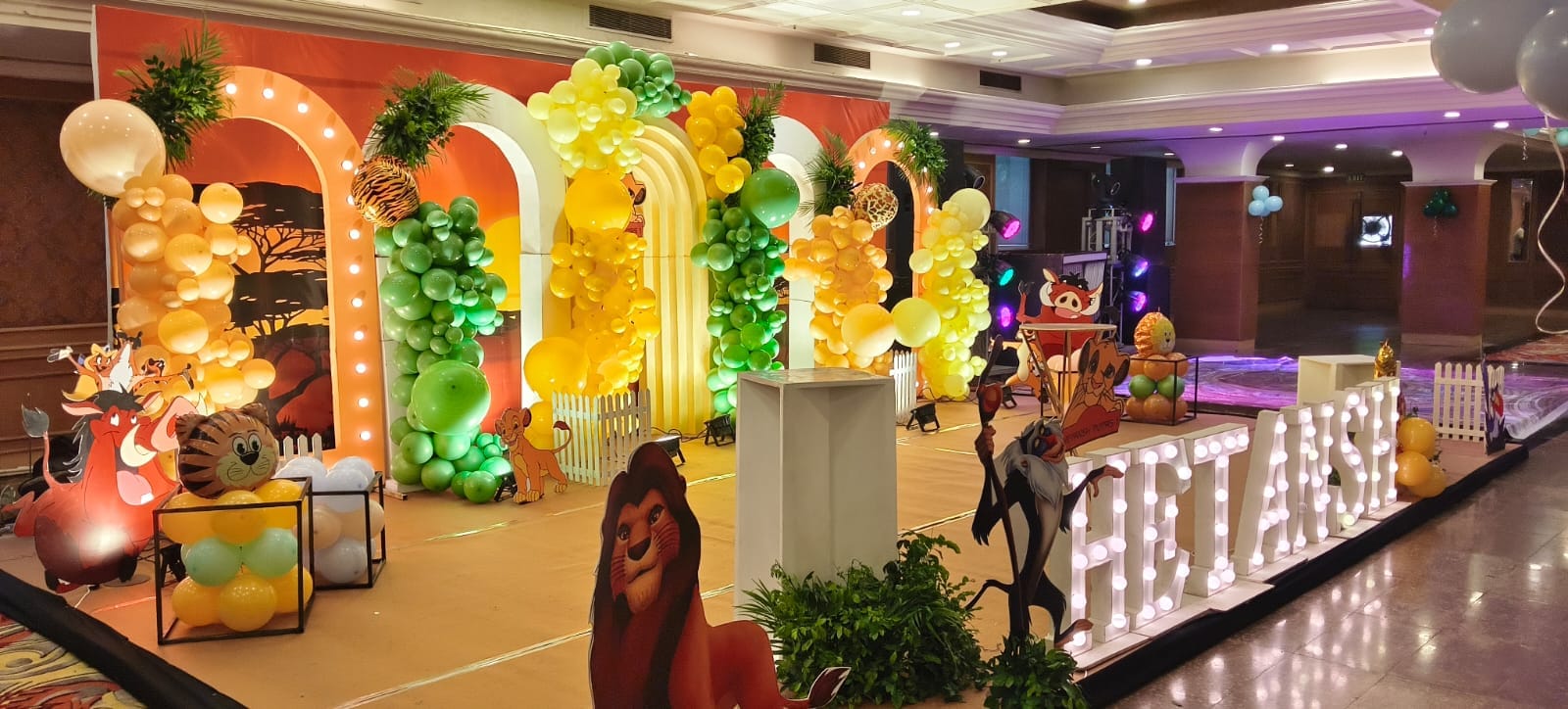 Colourful birthday installation with illuminated lettering