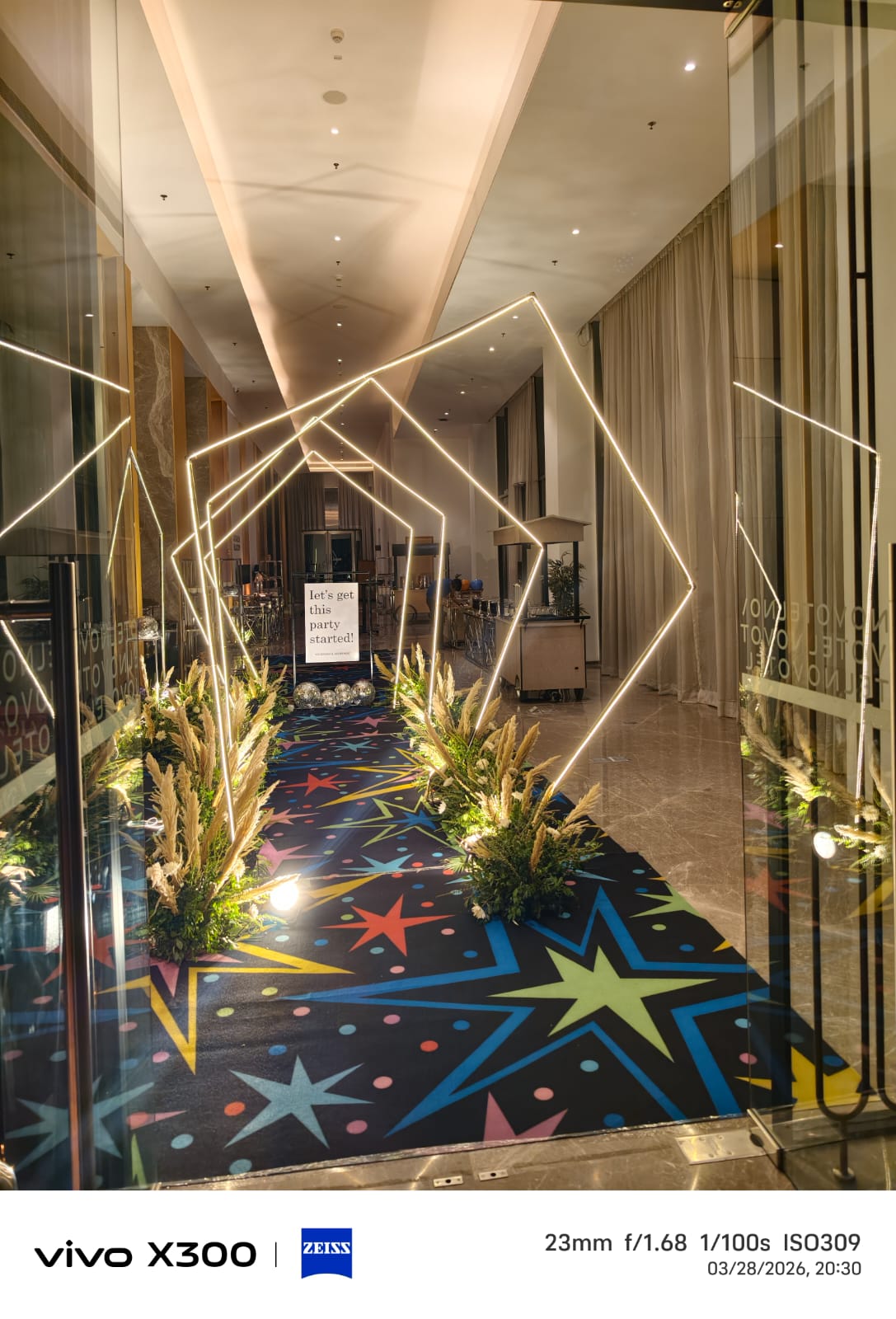 An illuminated event entrance prepared before guests arrive