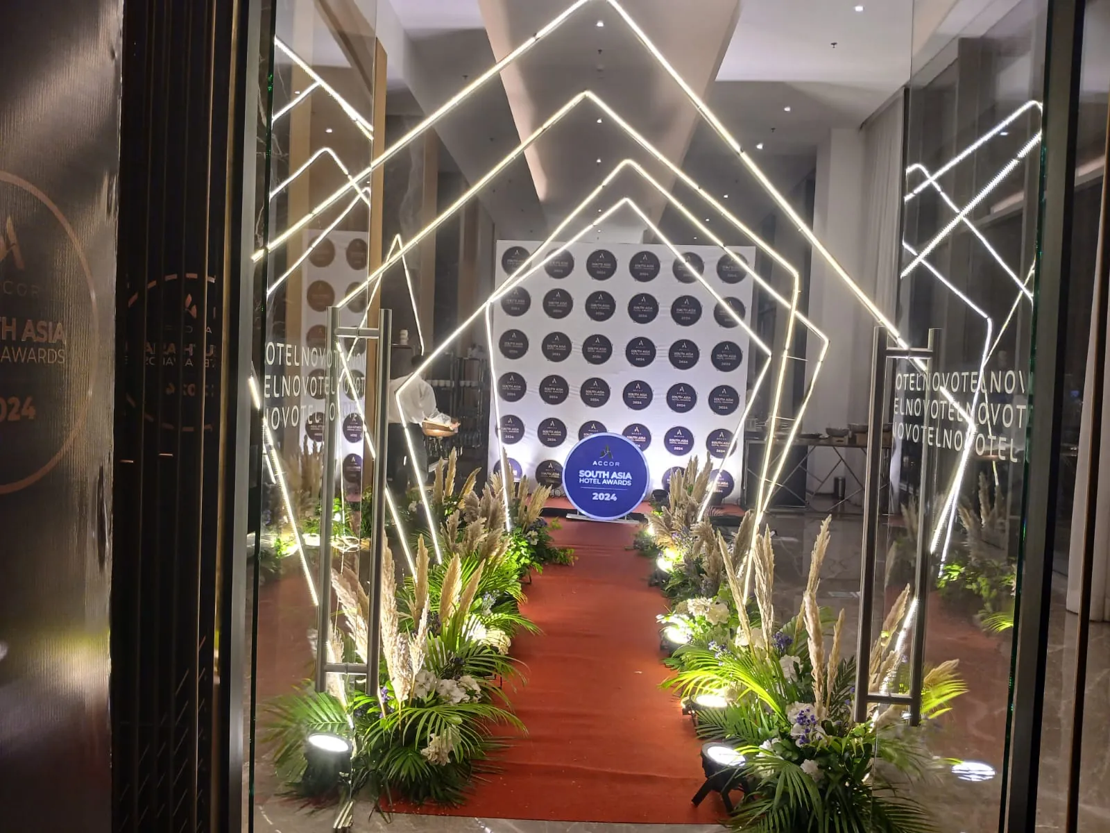 A mirrored entrance corridor leading into an event space