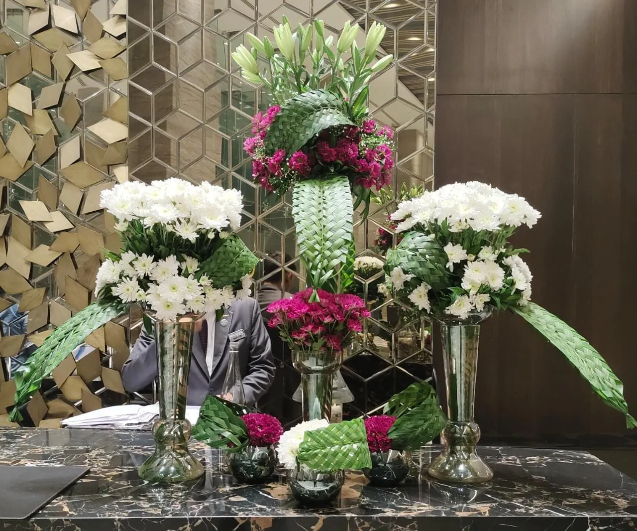 A layered flower arrangement in a corporate common area