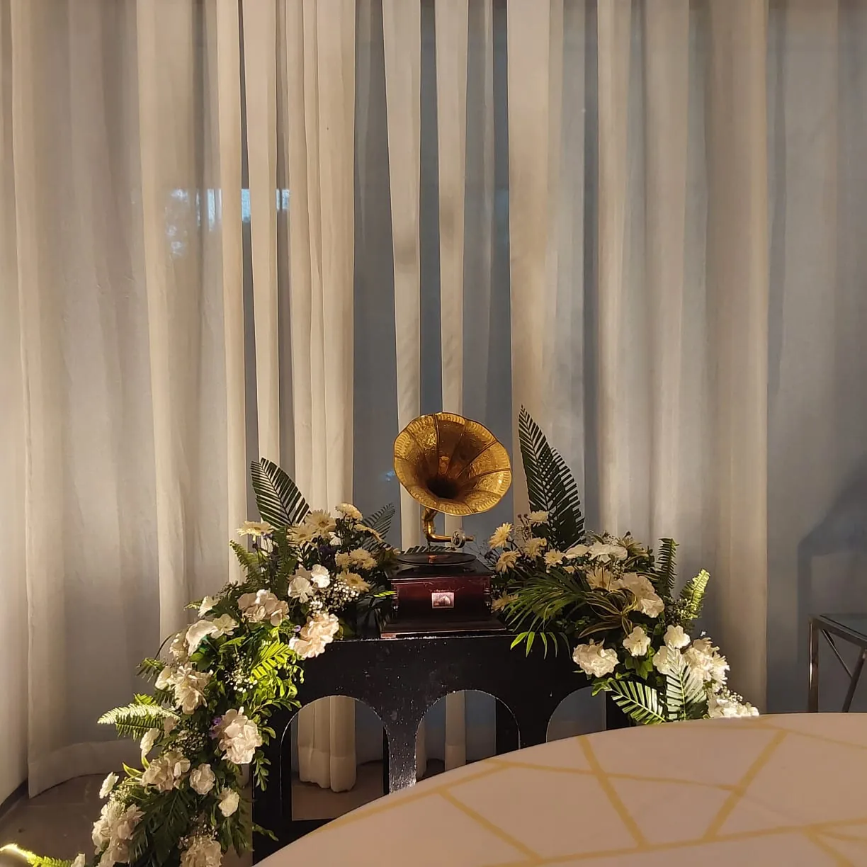 A close floral arrangement styled for a small gathering