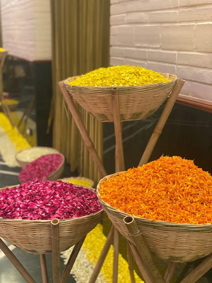 Baskets of marigold and rose petals prepared for a ceremony