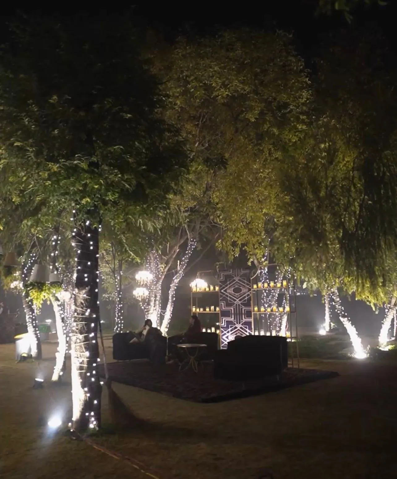 A tall outdoor installation set with warm evening lights
