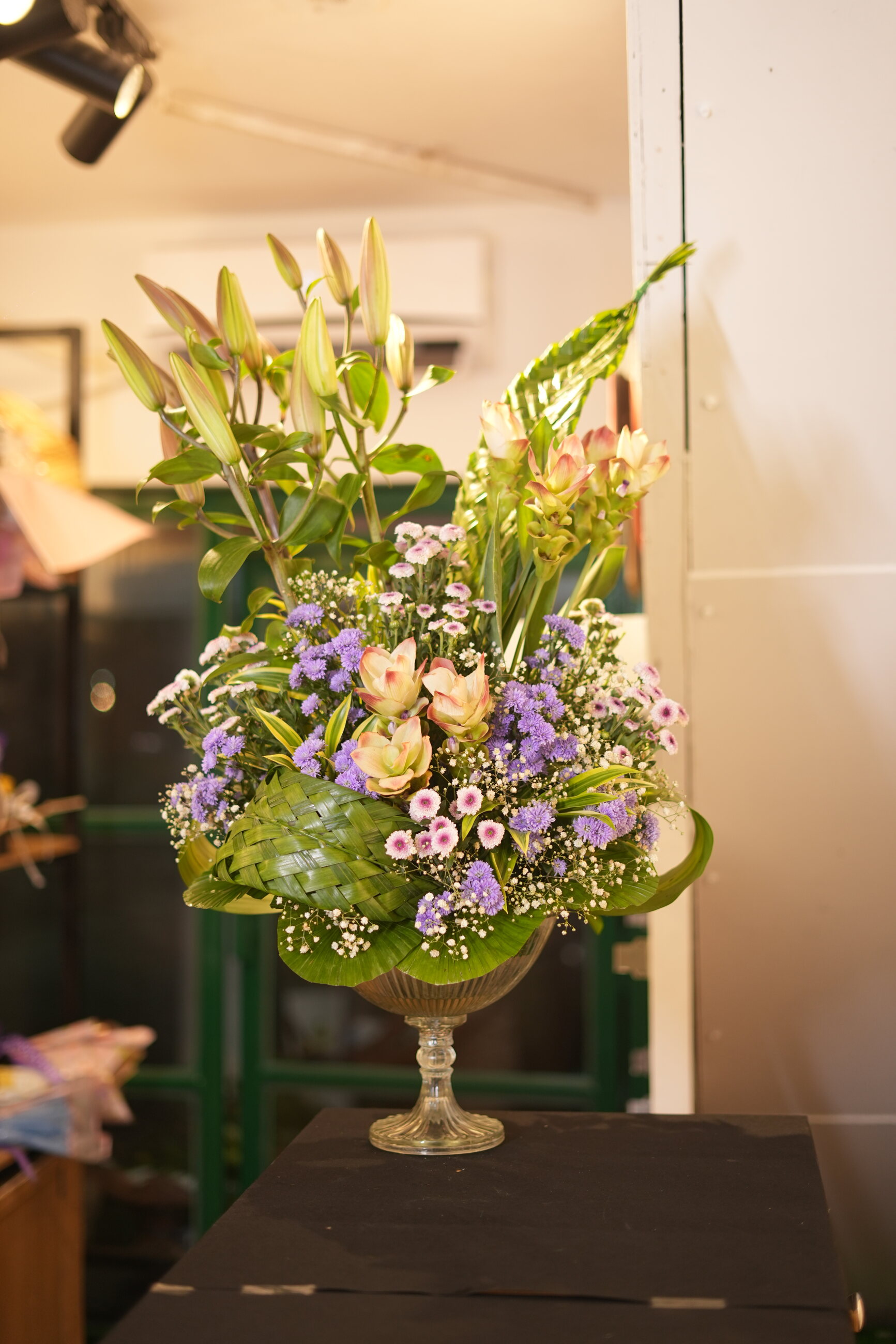 A pink, ivory, and lavender floral arrangement