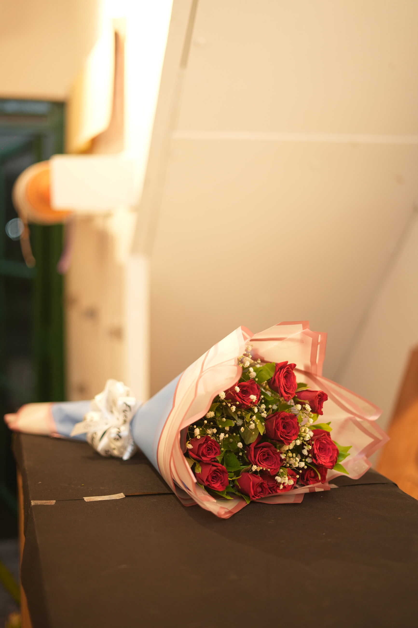 Hand-tied bouquet of deep pink and red flowers