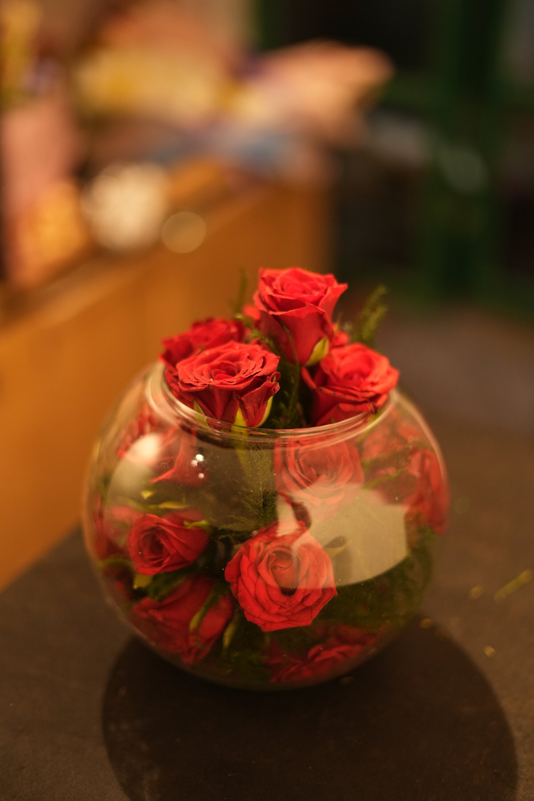 A cluster of red roses arranged in a glass vase